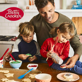 Betty Crocker Delights three-pack cake mix boxes on kitchen counter