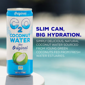C2O Original coconut water being poured over ice for refreshing electrolytes.