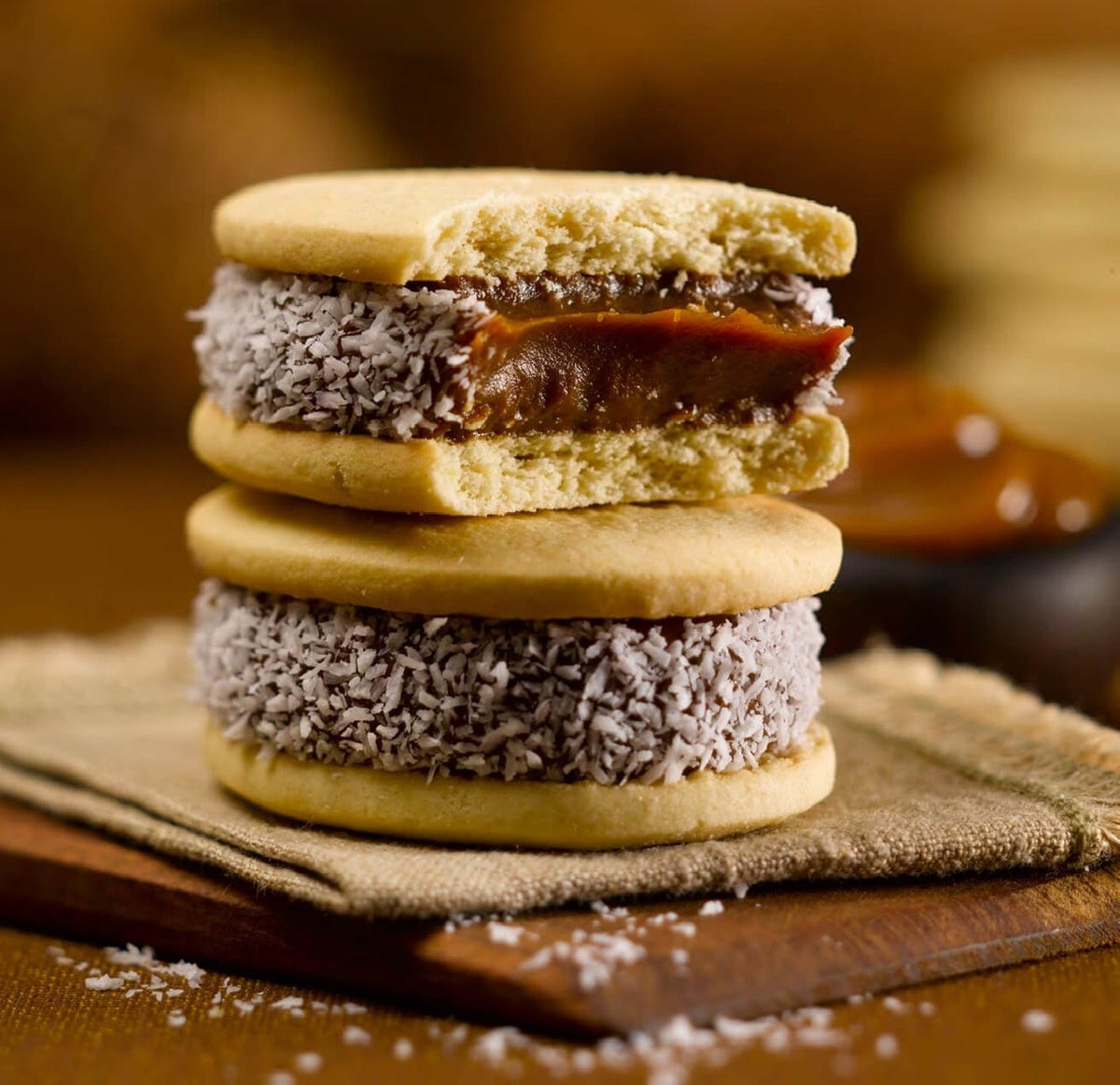 Cachafaz Alfajor Maizena close-up of dulce de leche center with coconut.