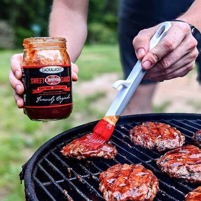 Natural ingredients badge beside Cackalacky Cheerwine Sweet BBQ Sauce.