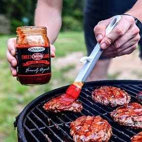 Natural ingredients badge beside Cackalacky Cheerwine Sweet BBQ Sauce.