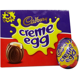 Cadbury Creme Eggs milk chocolate shell closeup highlighting glossy finish and inviting bite.