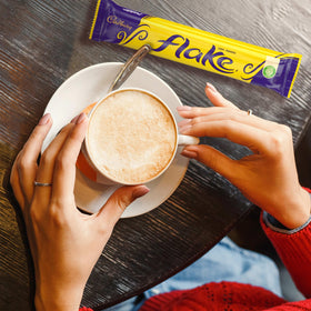 Cadbury Flake Bar crumbly chocolate close-up: melt-in-your-mouth texture and creaminess.