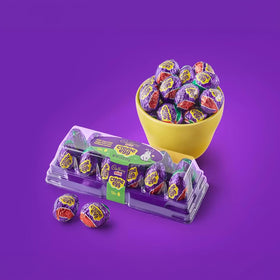 Cadbury mini creme eggs on a desk, ideal for office treats.