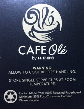 Cafe Olé Snickernut box opened beside a prepared cup signaling ready-to-brew convenience.