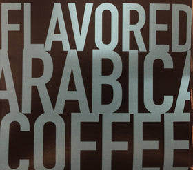 Cafe Olé Snickernut ground coffee close-up emphasizes premium Arabica.