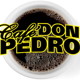 Cafe Don Pedro ground coffee texture with medium grind detail.