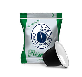 Caffè Borbone DEK decaf espresso pod close-up shows rich crema and aroma