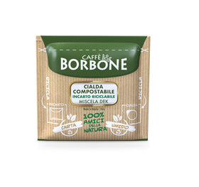 Caffè Borbone ESE green Dek pods closeup capturing rich crema potential.