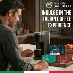 Caffè Garibaldi Sumatra dark roast beans beside a grinder for rich flavor.