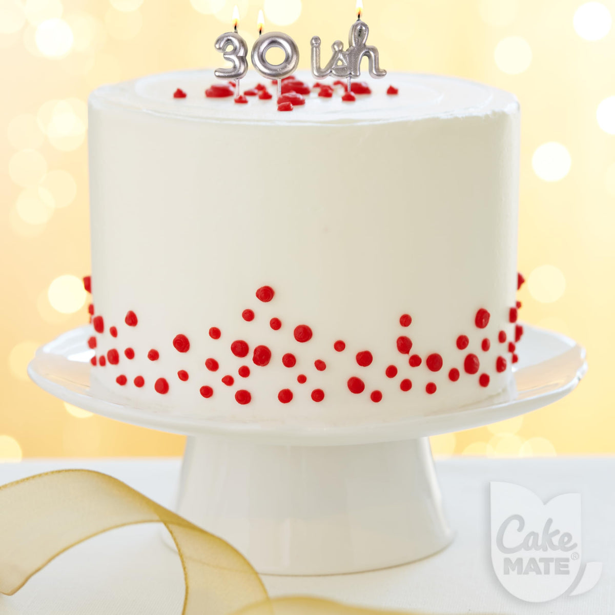 Cake Mate white edible writing gel for clean outlines on desserts.