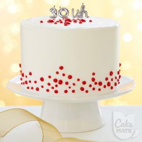 Cake Mate white edible writing gel for clean outlines on desserts.