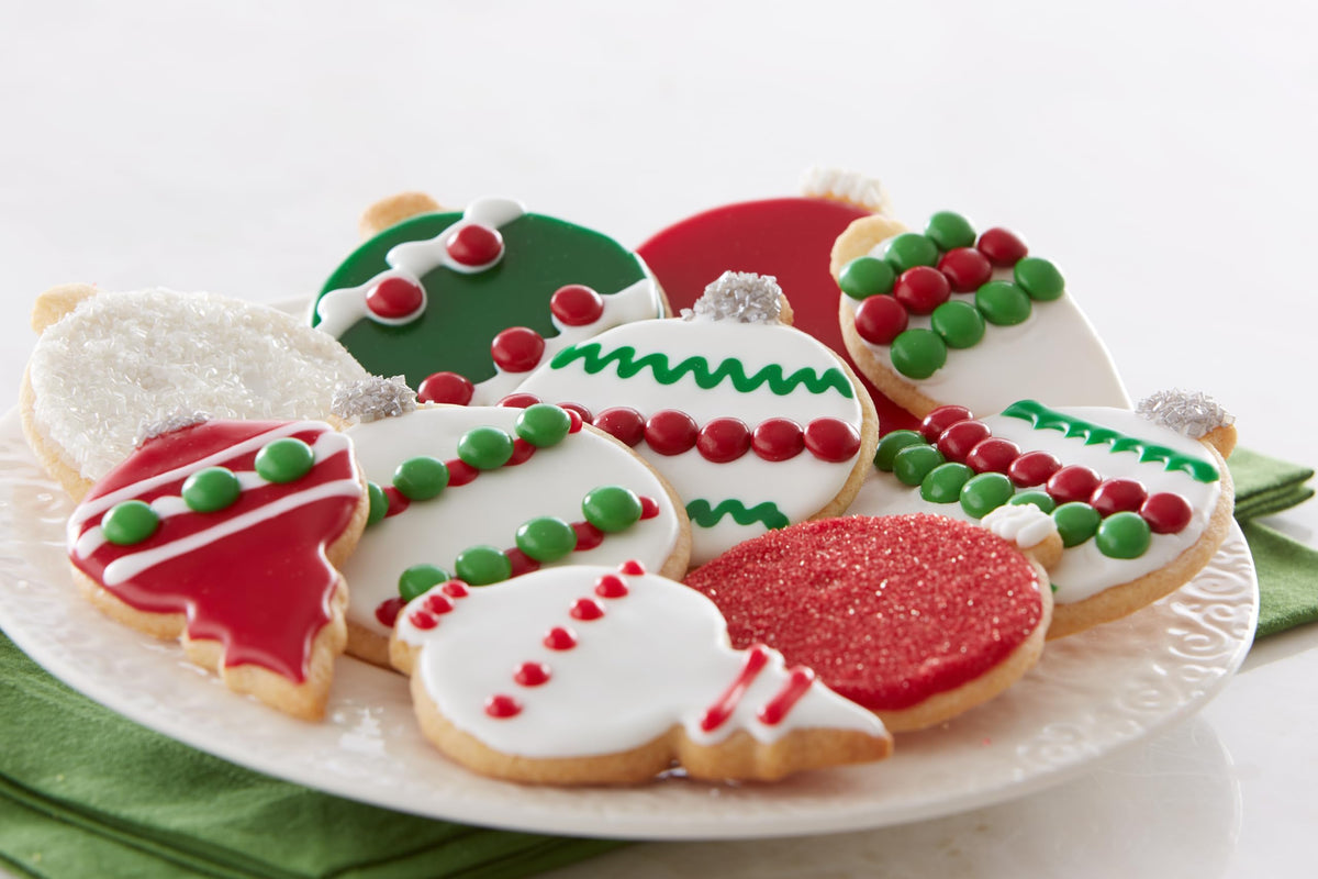 Vibrant red accents from Cake Mate sugar elevate holiday treats.
