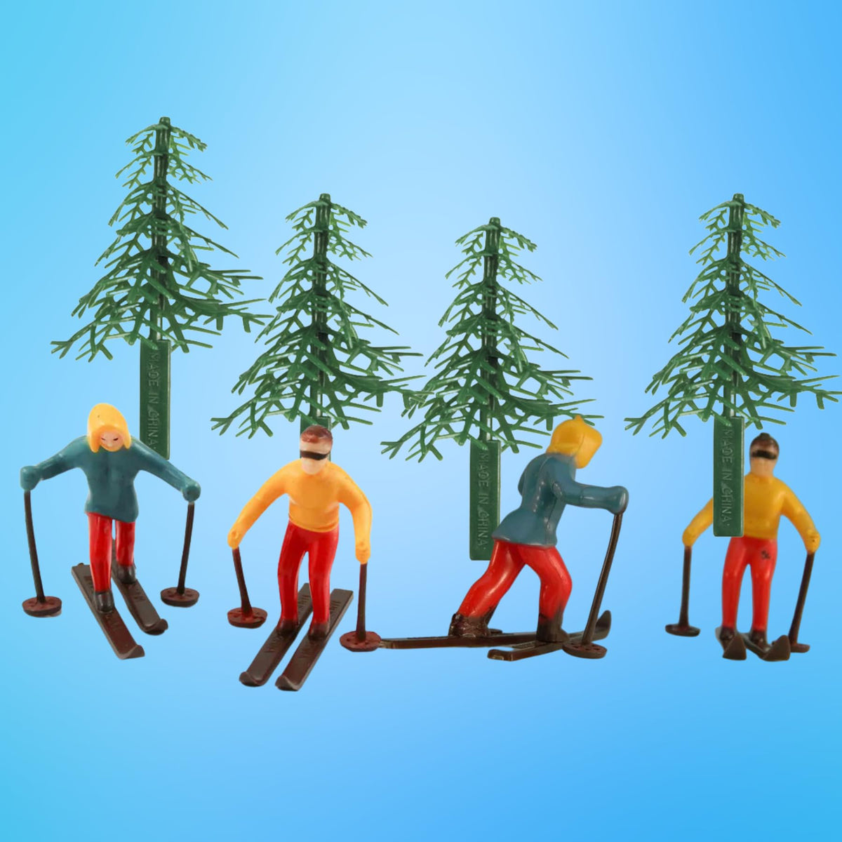 CakeSupplyShop Celebrations evergreen trees topper adds festive woodland charm to cakes