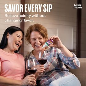 Droppers dispensing CalciBlend Wine Tamer into a glass for precise, odorless dosing.