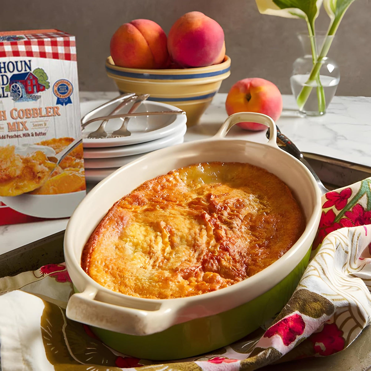 Calhoun Bend Mill Peach Cobbler bubbling in a dish during baking.