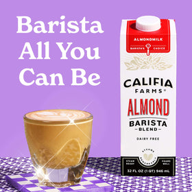 Califia Farms Almond Barista Blend foaming in a pitcher for latte art.