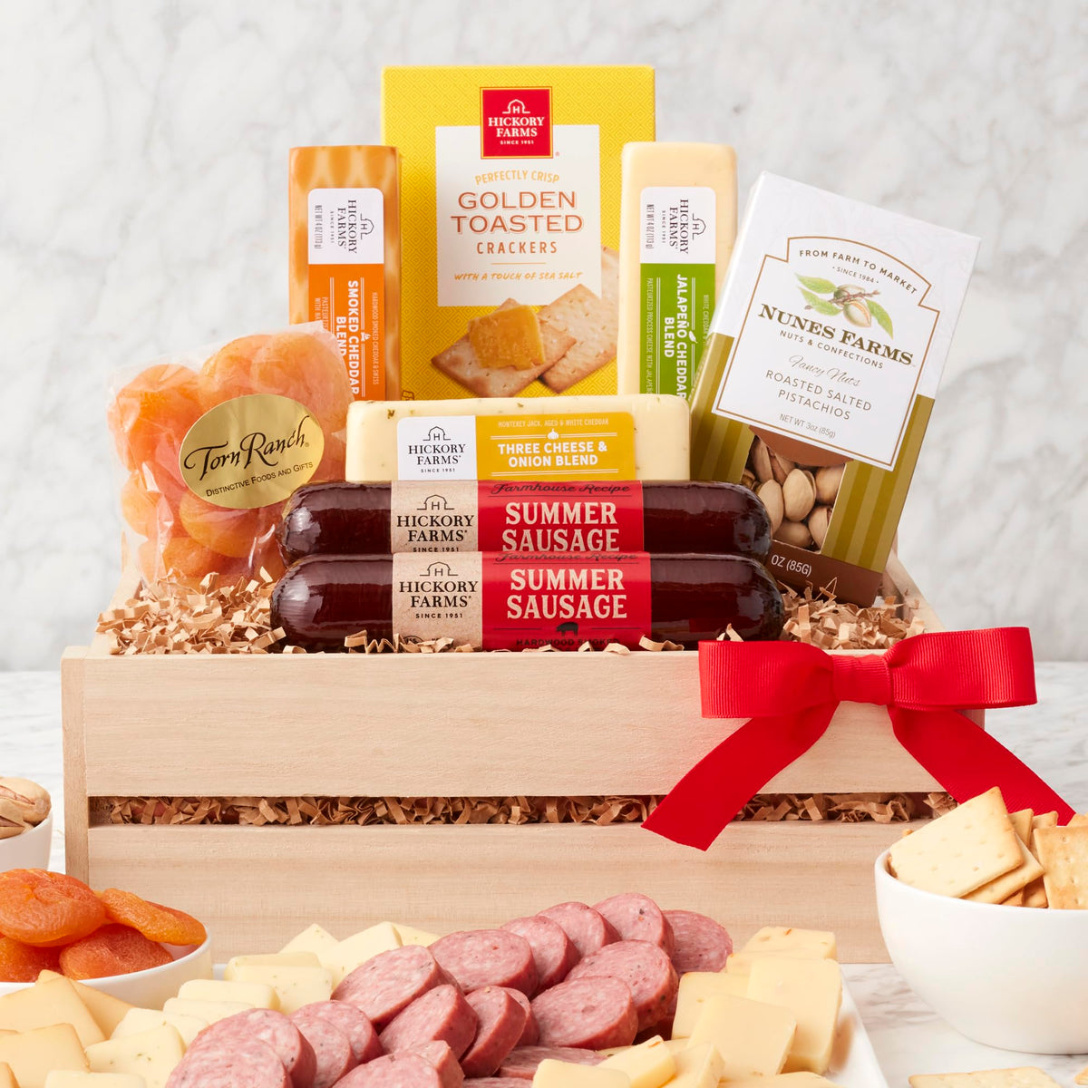 California Delicious meat and cheese gift crate with gourmet snacks for celebrations.