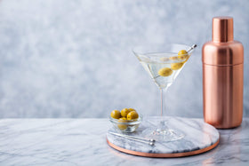 Cocktail glass with a finished Calivirgin Dirty Martini Mix martini.