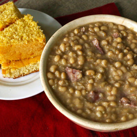 Camellia Brand Lady Cream peas in family kitchen scene emphasize wholesome plant-based protein.