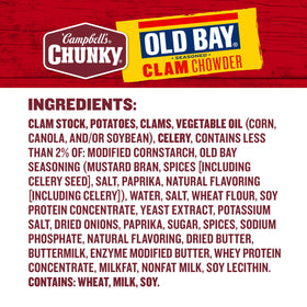 Chef's spoon shows chunky clams and potatoes in Campbell's Chunky OLD BAY Clam Chowder.
