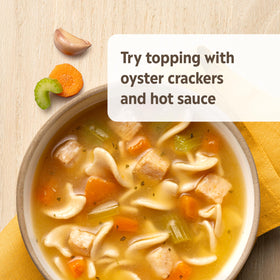 Campbell's Homestyle Chicken Noodle Soup serving suggestion with crackers.
