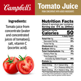 Pouring Campbell's tomato juice from the bottle for smooth flavor.