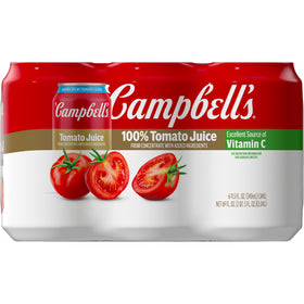 Pouring Campbell's tomato juice as a marinade base for meats.