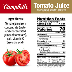 Campbell's tomato juice being poured over ice for a refreshing drink.