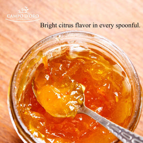 Campo D'Oro marmalade being poured over toast for a bright breakfast.