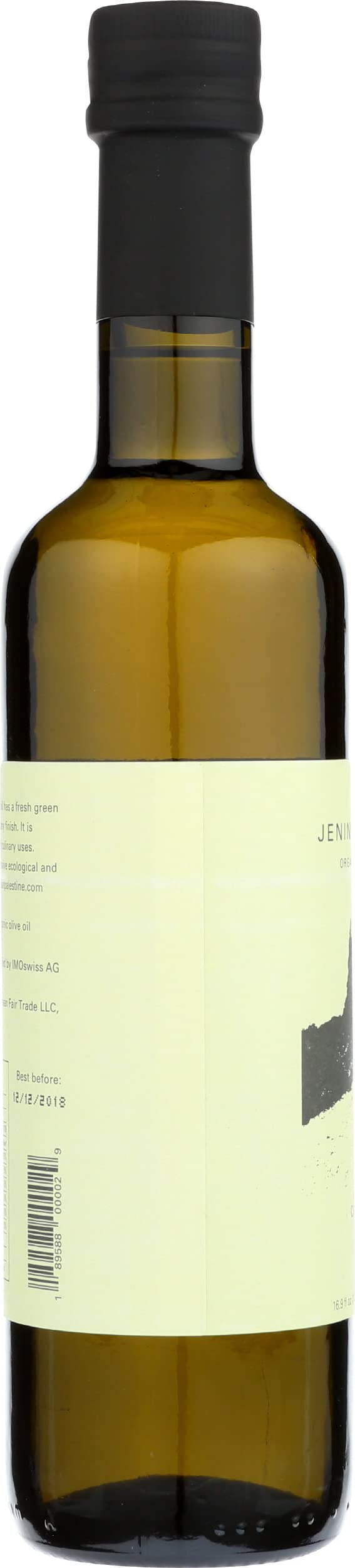 CANAAN Jenin EVOO glistening on fresh greens