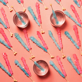 Candy Envy sticks used as a colorful garnish for drinks and desserts.