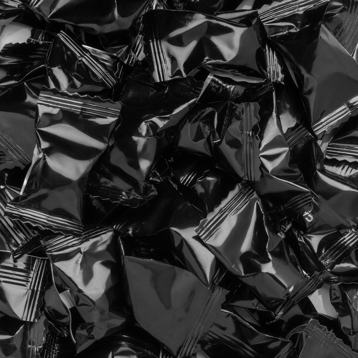 Candy Envy foil-wrapped buttermints close-up highlighting premium packaging and convenience.