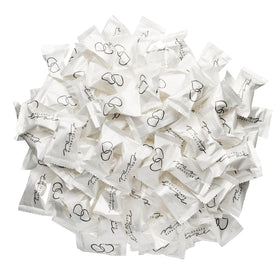 Guest favors featuring Candy Envy Celebrate Love buttermints in wrappers.