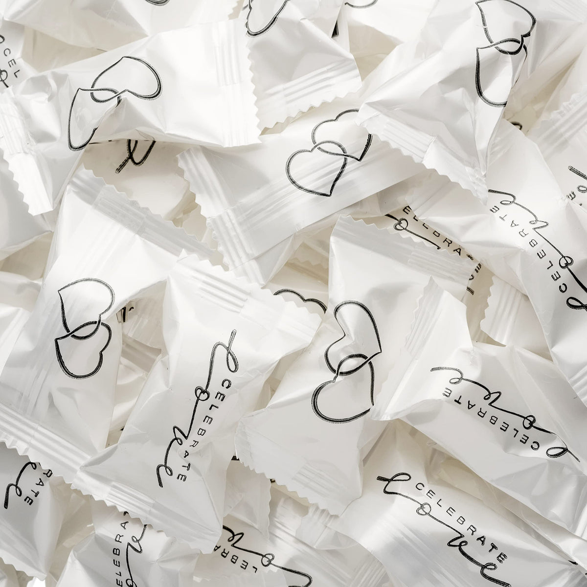 Candy Envy Celebrate Love buttermints wrapped for weddings.