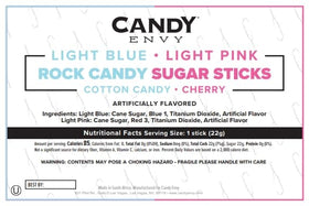 Candy Envy gender reveal party favor with pink and blue sticks.