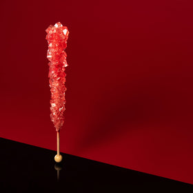 Candy Envy Red Rock Candy Sticks with drink pairing ideas for celebrations.
