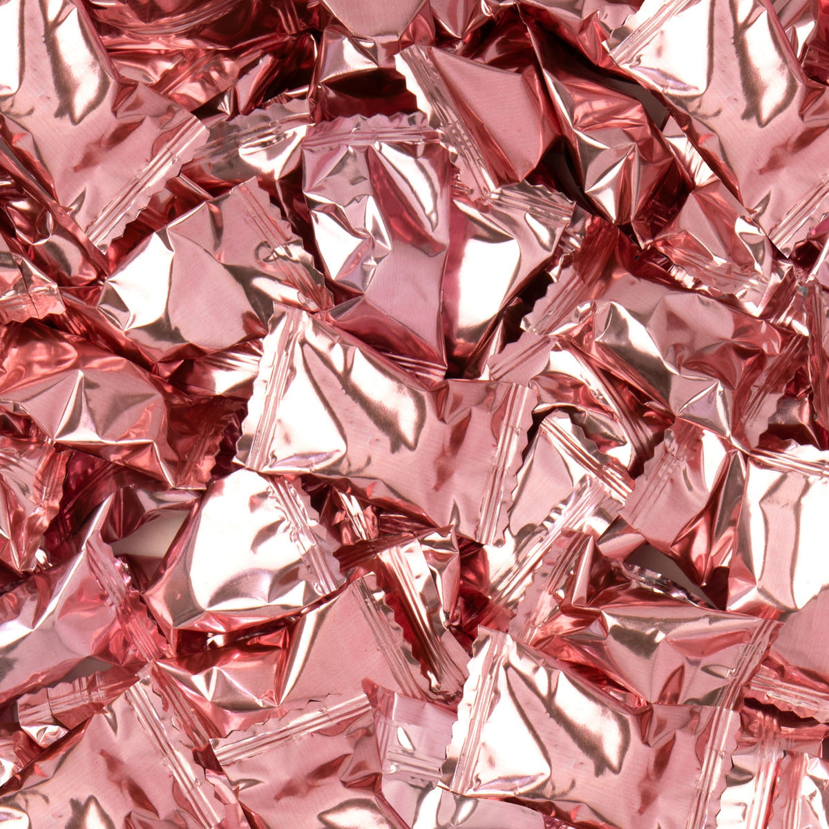 Close-up of Candy Envy Rose Gold Foil Buttermints wrappers.
