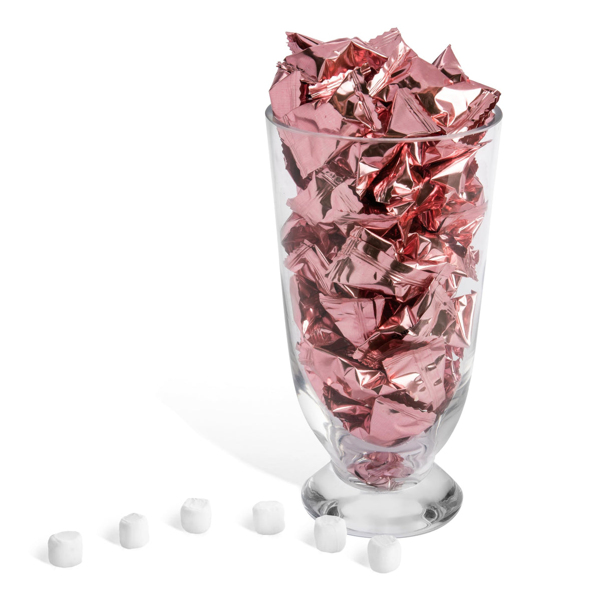 Rose gold wrapped buttermints from Candy Envy in decorative dish.