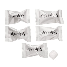 Candy Envy wedding favor packaging displayed at reception tables.