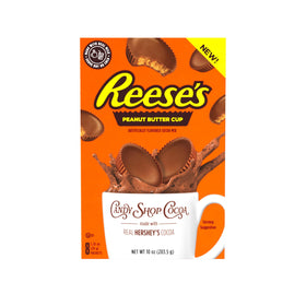 Candy Shop Cocoa Mix dissolving into a creamy cup with milk.