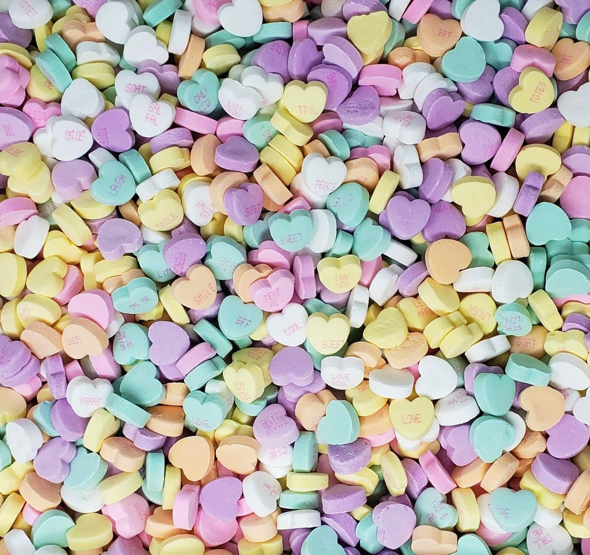 Candy Retailer sealed stand-up pouch showcases pastel hearts with festive sayings, ideal for gifting.