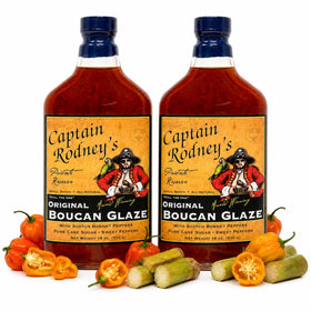 Captain Rodney's Boucan Glaze bottle being poured for bold sweet heat.