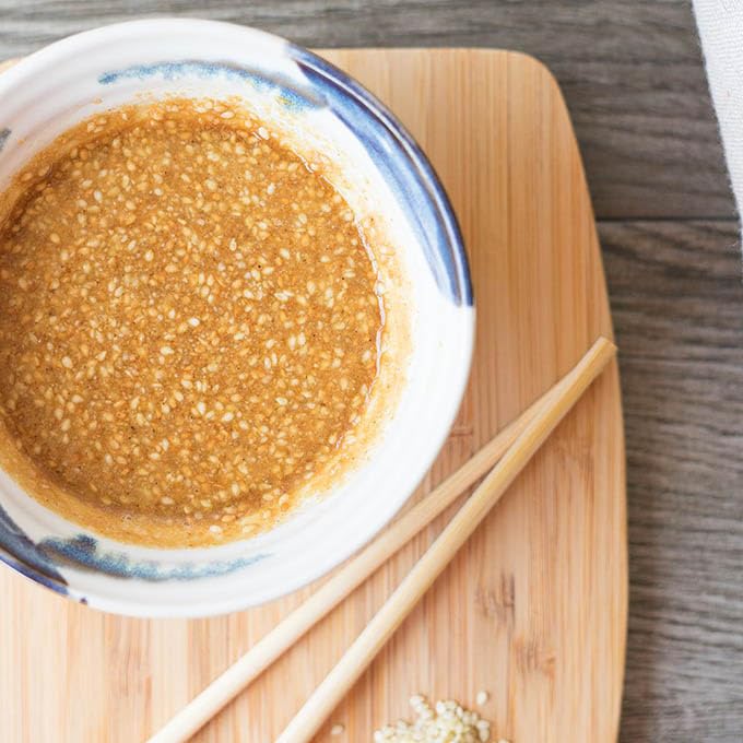 CARALARGA Golden Creamy Roasted Sesame Dressing on tuna slices for delicate flavor
