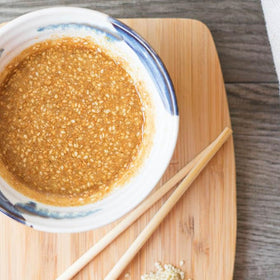 CARALARGA Golden Creamy Roasted Sesame Dressing on tuna slices for delicate flavor