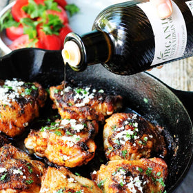 Carapelli Organic EVOO with fresh vegetables for a healthy finish.