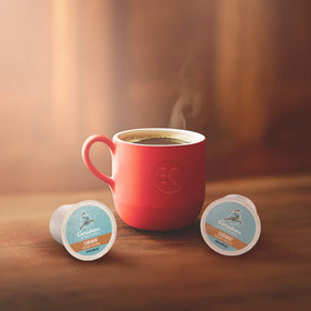 Packaging closeup of Caribou Blend K-Cup shows Rainforest Alliance certification.