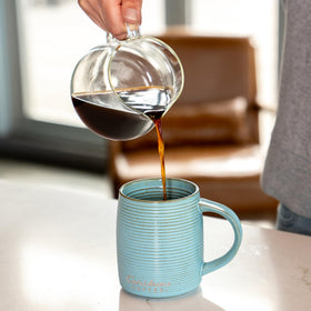 Caribou Coffee caramel-flavored coffee invites comforting sips during breaks.