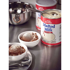 Stacked Carnation cans in a pantry highlight easy back-of-house storage.