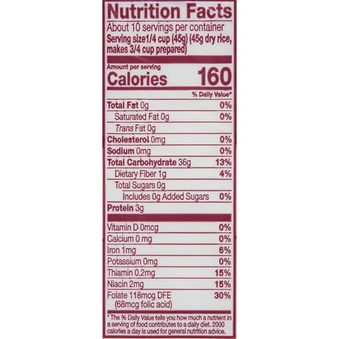 Measuring cup with dry Carolina Enriched Rice for portions